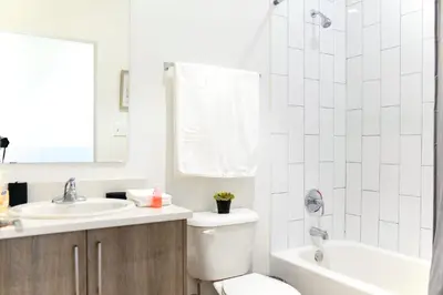 a bathroom with a toilet and a sink at Entire House with Free Parking at North Miami! in Miami