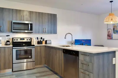 a kitchen with a sink and a stove top oven at Entire House with Free Parking at North Miami! in Miami