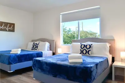 a bedroom with two beds and a window at Entire House with Free Parking at North Miami! in Miami