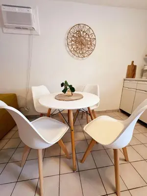 a white table and chairs in a kitchen at Hidden Tropical Gem Calle Ocho 1 in Miami