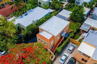 a model of a house with flowers in front of it at Hidden Tropical Gem Calle Ocho 1 in Miami