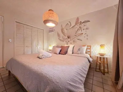 a bedroom with a large bed in a room at Hidden Tropical Gem Calle Ocho 1 in Miami