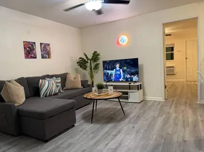 a living room with a couch and a tv at New comfortable and youthful sport in Fort Lauderdale