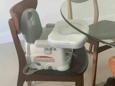a washing machine sitting on a chair with a vacuum at Spacious 3 BR plus 1 office and 2 BA with Free parking Just in front beach in Sunny Isles Beach