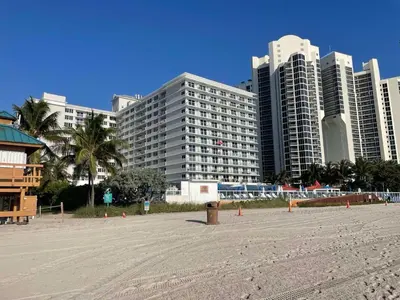 a sandy beach with tall buildings in the background at Beach Escape private studio in Sunny Isles Beach