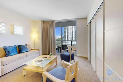 a living room with a couch and a table at 1BR Apartment with Ocean View in Sunny Isles Beach