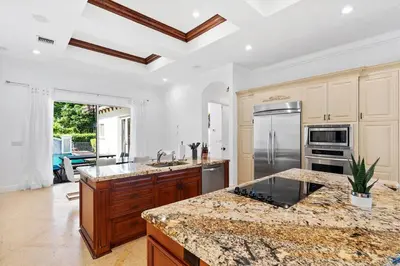 a kitchen with a counter top and a stove top oven at Luxurious 5BR and 3BA Lakefront Villa near Beach in Hollywood