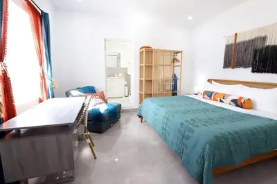 a bedroom with two beds and a couch at Rooftop Retreat on Ocean Drive with Beach View in Miami Beach