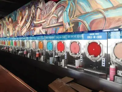 a row of different colored buttons on a wall at Rooftop Retreat on Ocean Drive with Beach View in Miami Beach