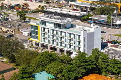 an aerial view of a building in a city at Milan Aventura Hotel in Aventura