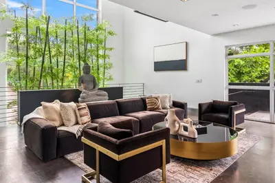 a living room with a couch and a table at Villa Nova in Miami