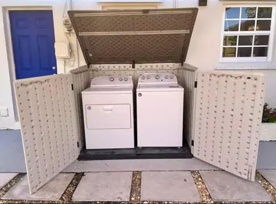 an outdoor kitchen with a stove and a blue door at Tropical Retreat in Miami Beach in North Miami Beach