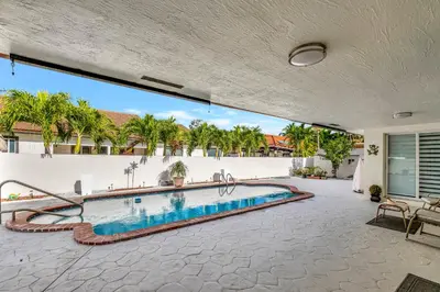 an image of a swimming pool in a house at Dreams Studio in Hialeah
