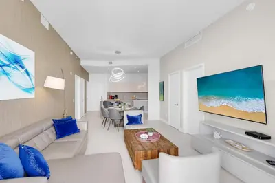 a living room with a couch and a table at 2BR Ocean View Balcony & Pool in Hollywood