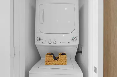 a washer and dryer sitting on top of a toilet at 2BR Ocean View Balcony & Pool in Hollywood