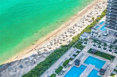 an aerial view of a beach with umbrellas at 2BR Ocean View Balcony & Pool in Hollywood