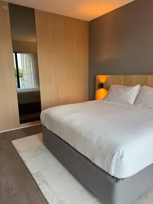 a bedroom with a large white bed and a window at The March Hotel in Miami Beach