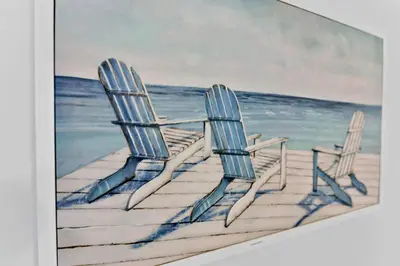 two chairs sitting on a dock at the beach at Celeste House Enjoy Caribbean 2 BR APT in Miami