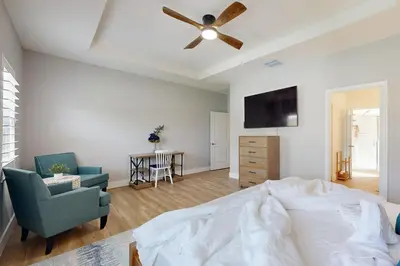 a bedroom with a bed and a ceiling fan at Outdoor Oasis! Group-Friendly Miami Getaway in Burrs Strip