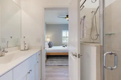 a bathroom with a sink and a shower and a bed at Outdoor Oasis! Group-Friendly Miami Getaway in Burrs Strip
