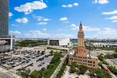 a city with a clock tower and a parking lot at PH 5107 Gale Luxury 1BR with Sea - Downtown Views in Miami