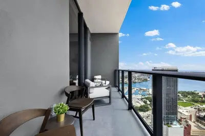 an apartment balcony with a view of the ocean at PH 5107 Gale Luxury 1BR with Sea - Downtown Views in Miami