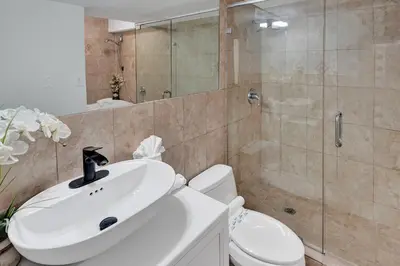 a bathroom with a sink and a toilet and a shower at Ocean View Serenity Condo Beach Service 915 in Miami Beach