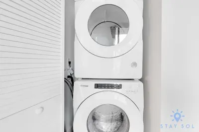 a washing machine in a bathroom with a washer at Stylish 2BR with Pool & Balcony in Miami