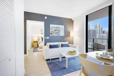 a living room with a couch and a table at Stylish 2BR with Pool & Balcony in Miami