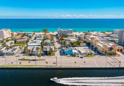 an aerial view of a beach with a boat in the water at Villa Treasure on the beach by The Gold Nests in Hollywood