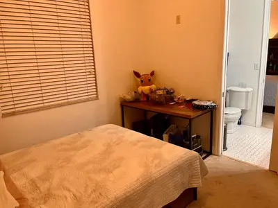 a bedroom with a table with a stuffed animal on it at Fort Lauderdale Oasis private rooms in shared house in Fort Lauderdale