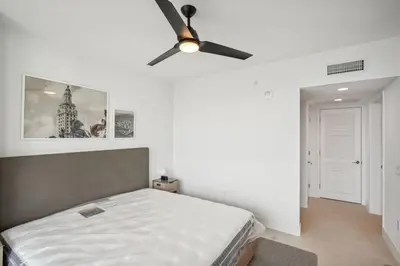 a bedroom with a bed and a ceiling fan at NEW Luxury Bay View Downtown 1 Bedroom in Miami