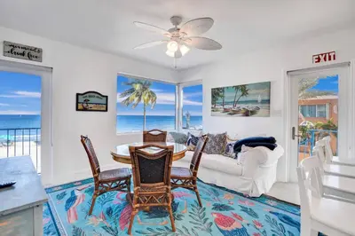 a living room with a table and chairs at Sunset Oceanfront Paradise in Hollywood