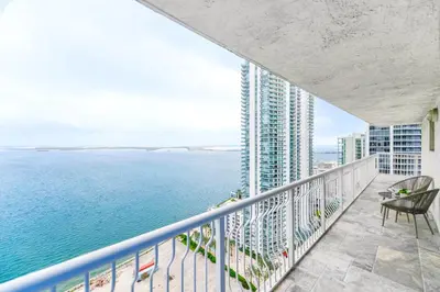 a balcony with a view of the ocean at Open the Window and Enjoy the Sea Breeze at Exclusive Condo! in Miami