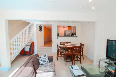 a living room with a table and a dining room at Castle L5 Oceanview Double-loft with pool, beach access, tennis, free parking! in Miami Beach