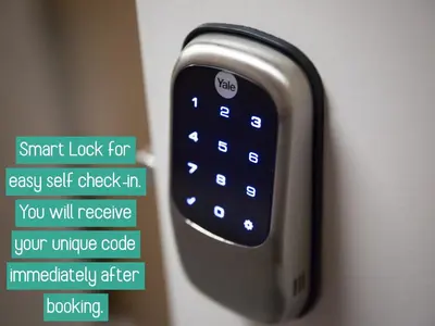 a close up of a remote control on a wall at Big TV 2 Bedroom Apartment Cooper City in Cooper City