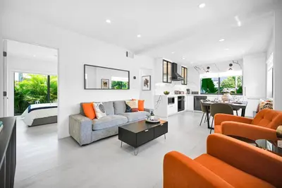a living room with a couch and a table at Modern Private Oasis by Design District & Wynwood in Miami