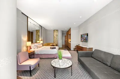 a hotel room with a bed and a couch at Luxury King Suite W City view at SLS Brickell in Miami