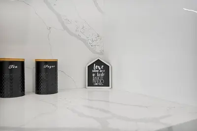 three trash cans sitting on top of a counter at Modern Studio Near Design District, Wynwood in Miami