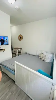a bedroom with a large bed in a room at The Tiny Red Mini Studio At Little Havana in Miami