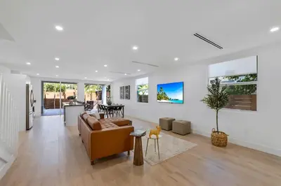 a living room with a couch and a table at Up to 12 guests! Modern Villa near Wynwood 29! in Miami