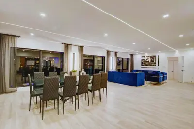 a meeting room with a long table and chairs at Club House 305 w PRIVATE NIGHTCLUB, Cinema, Game Room, Gym & Pool in Miami