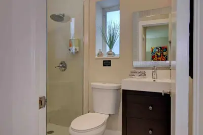 a bathroom with a toilet and a sink and a shower at The Palms Villa with Cinema, Game Table, Pool, Jacuzzi , Giant Chess, 8 Beds in Miami