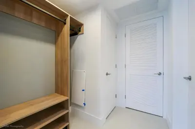 a bedroom with a closet and a refrigerator at New unit 28th Floor with Unbeatable Bayside Views in Miami