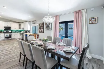 a kitchen and dining room with a table and chairs at Miami amazing location, Luxury & Spacious, Large pool, BBQ, Game room, Pool in Miami