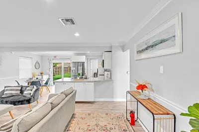 a living room with a couch and a kitchen at 5 Minutes to Ocean & Casino's - Large Backyard in Hollywood
