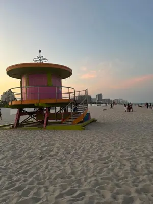a lifeguard tower on a beach with people on it at Luxe ocean drive condo in miami south beach in Miami Beach