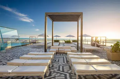 avisor rendering of a resort with beds and the ocean at Stylish 1BR Suite with 5 Star Amenities and Stunning Views in Fort Lauderdale