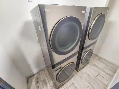 two washing machines are in a corner of a room at Central Miami 1BR Suite Close to Beach & Downtown in Miami