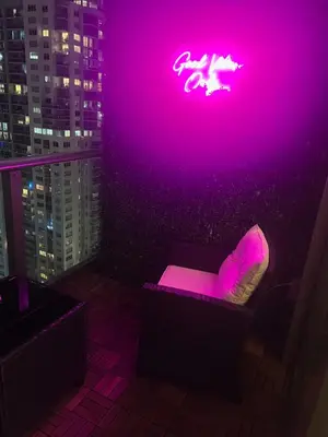 a room with a neon sign on the wall at Lumiére Penthouse in Miami